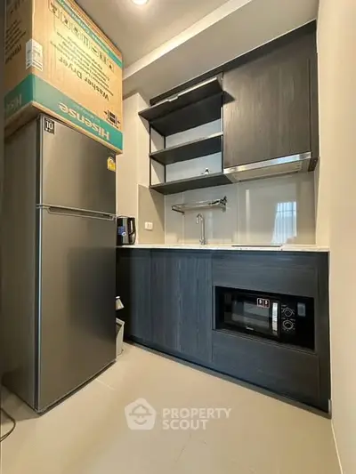 Modern kitchen with sleek cabinets and stainless steel appliances