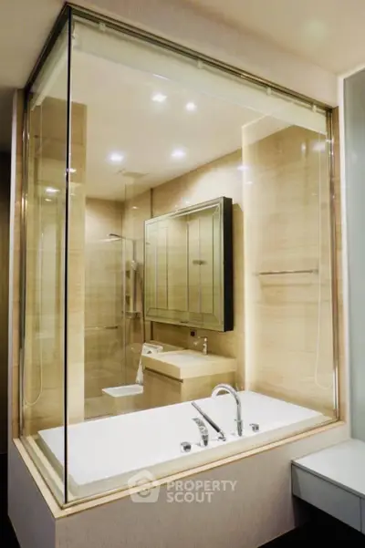 Luxurious modern bathroom with glass-enclosed bathtub and elegant fixtures