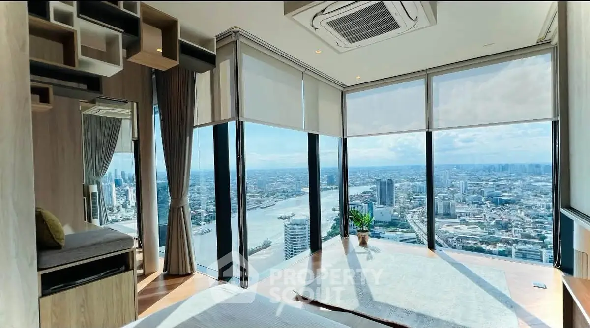 Luxurious corner unit with panoramic city and river views, featuring floor-to-ceiling windows and modern decor.