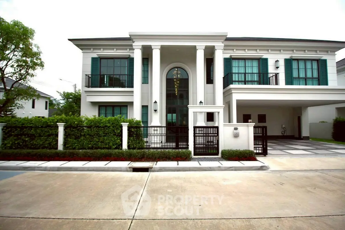 Luxurious modern villa with grand entrance and elegant facade, perfect for upscale living.
