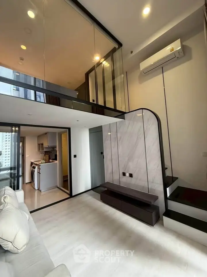 Modern duplex apartment with high ceilings and sleek interior design