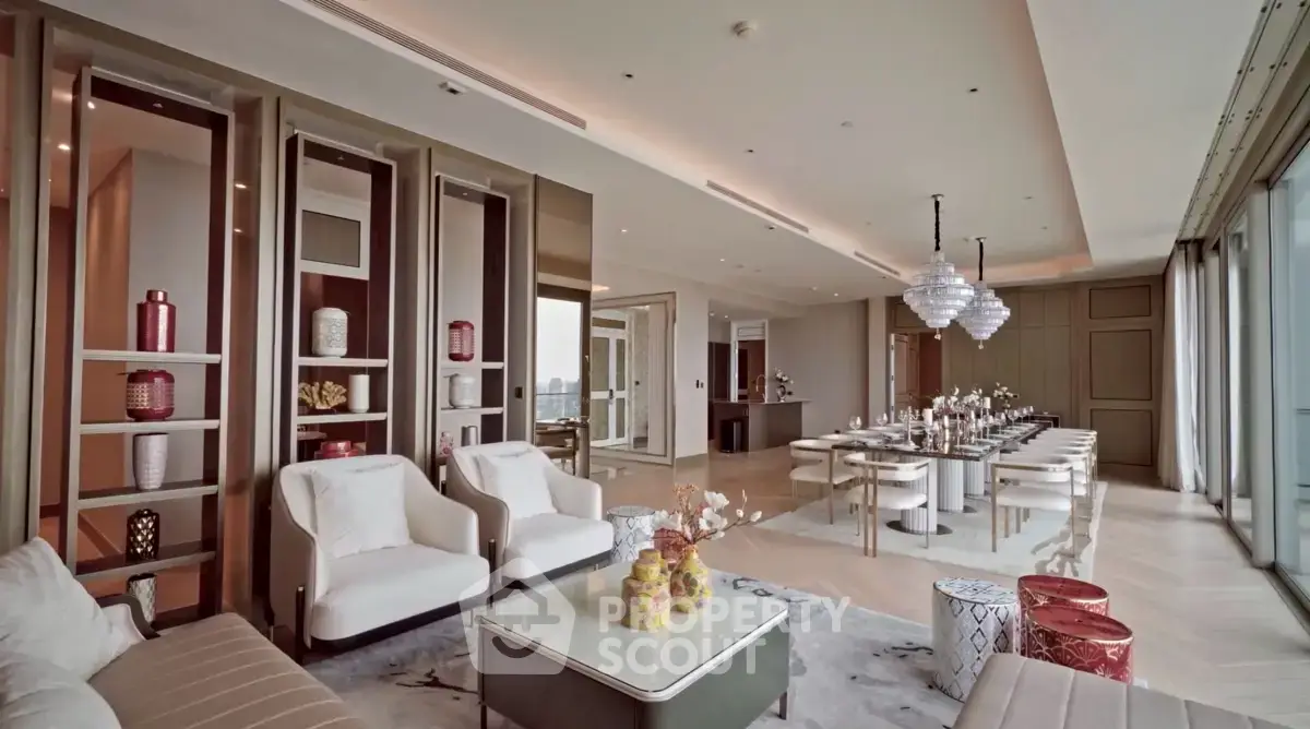 Luxurious open-plan living and dining area with elegant decor and panoramic windows.
