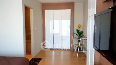 Modern apartment interior with sleek furniture and bright natural lighting.