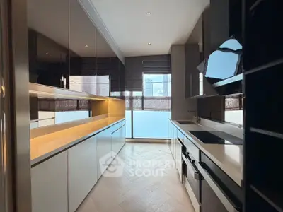 Sleek modern kitchen with high-gloss cabinets and built-in appliances