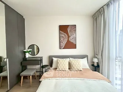 Modern bedroom with stylish decor and natural light