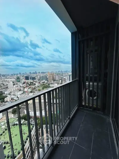 Stunning city view from modern high-rise balcony with sleek railing design.