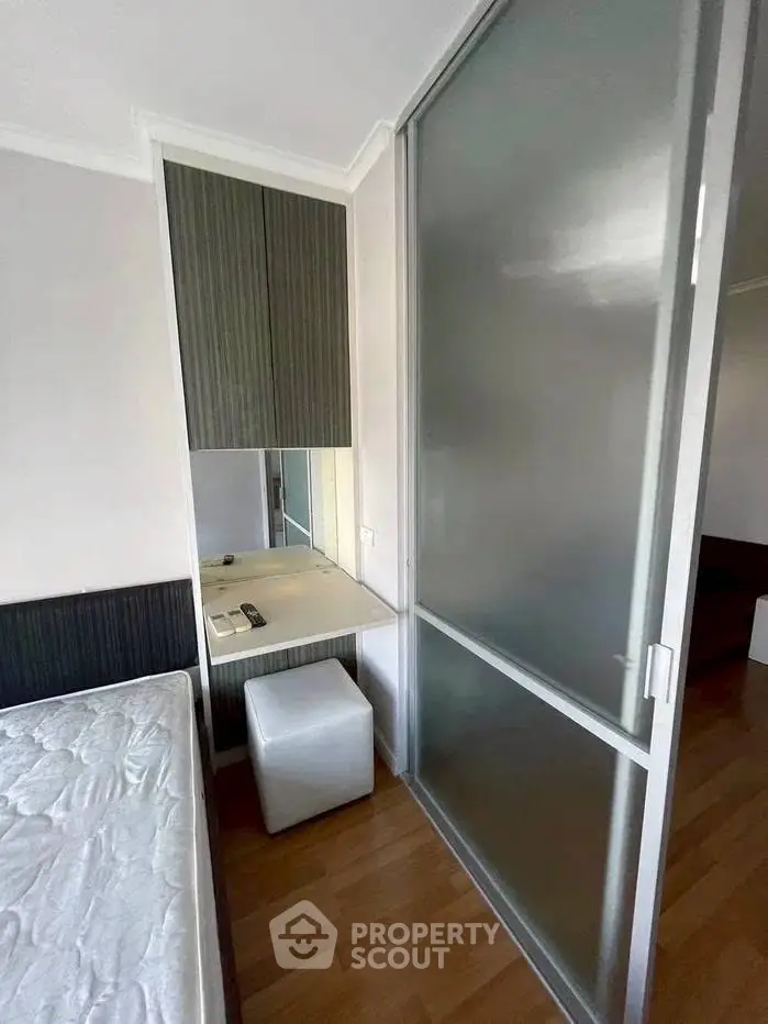 Modern bedroom with sliding glass door and stylish furniture
