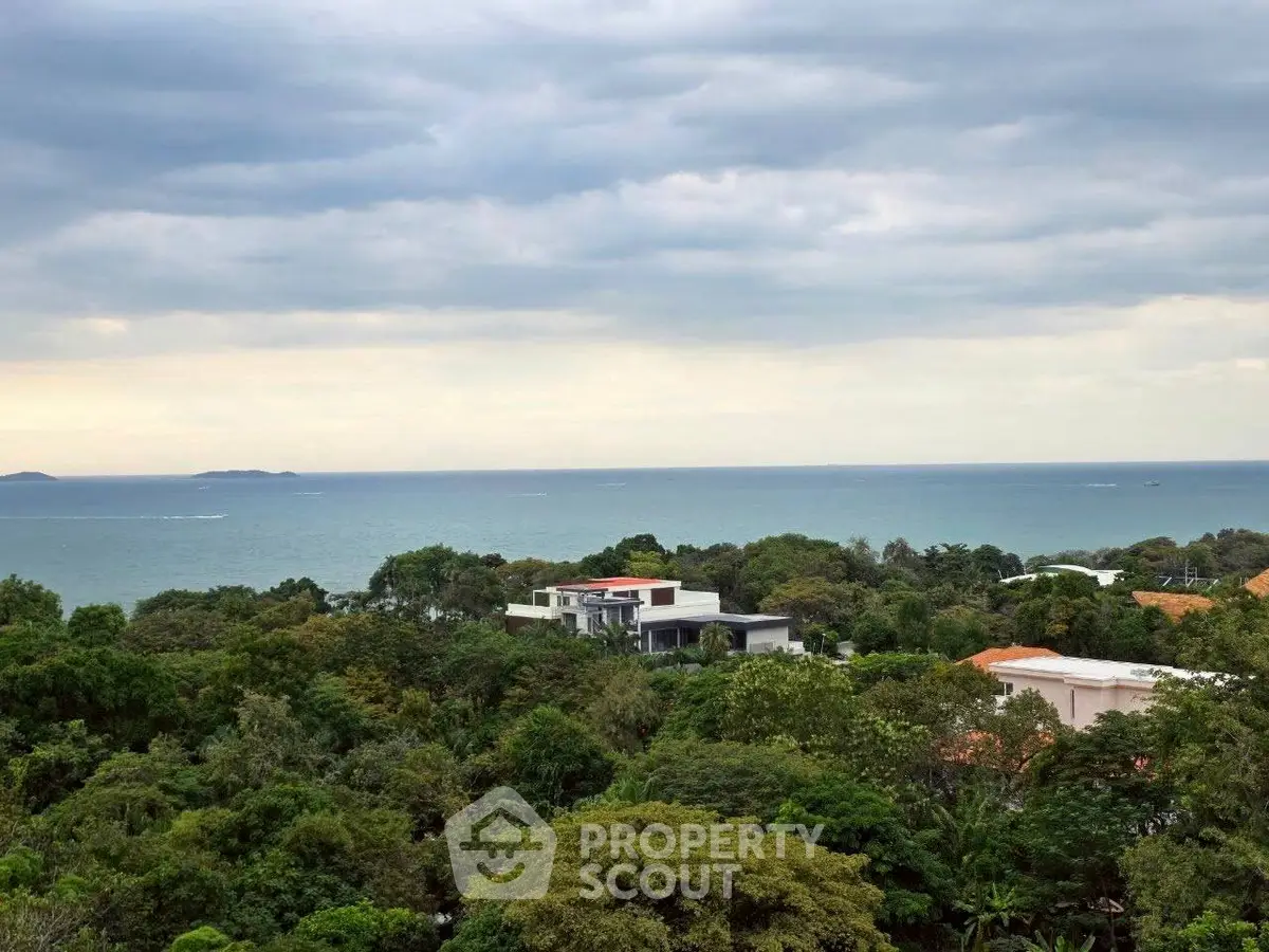 Stunning ocean view from a lush green property, perfect for serene living.