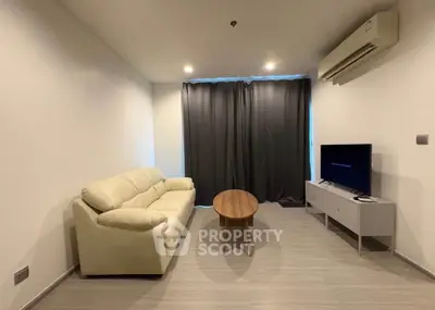 Modern living room with sleek furniture and air conditioning