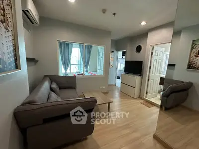 Modern living room with cozy sofa and stylish decor in a contemporary apartment.