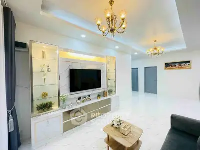 Luxurious living room with elegant chandeliers and modern decor