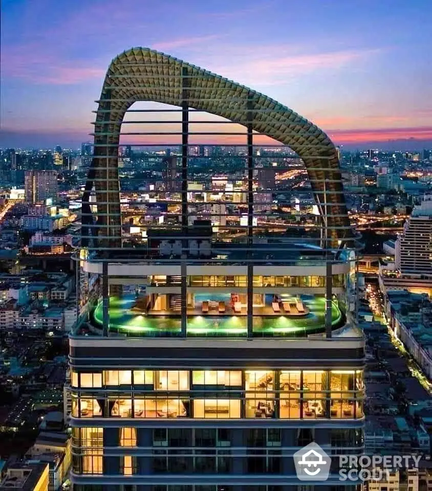 Stunning rooftop view of a modern skyscraper with unique architectural design in a vibrant cityscape.