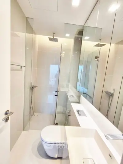 Modern bathroom with sleek glass shower and contemporary fixtures