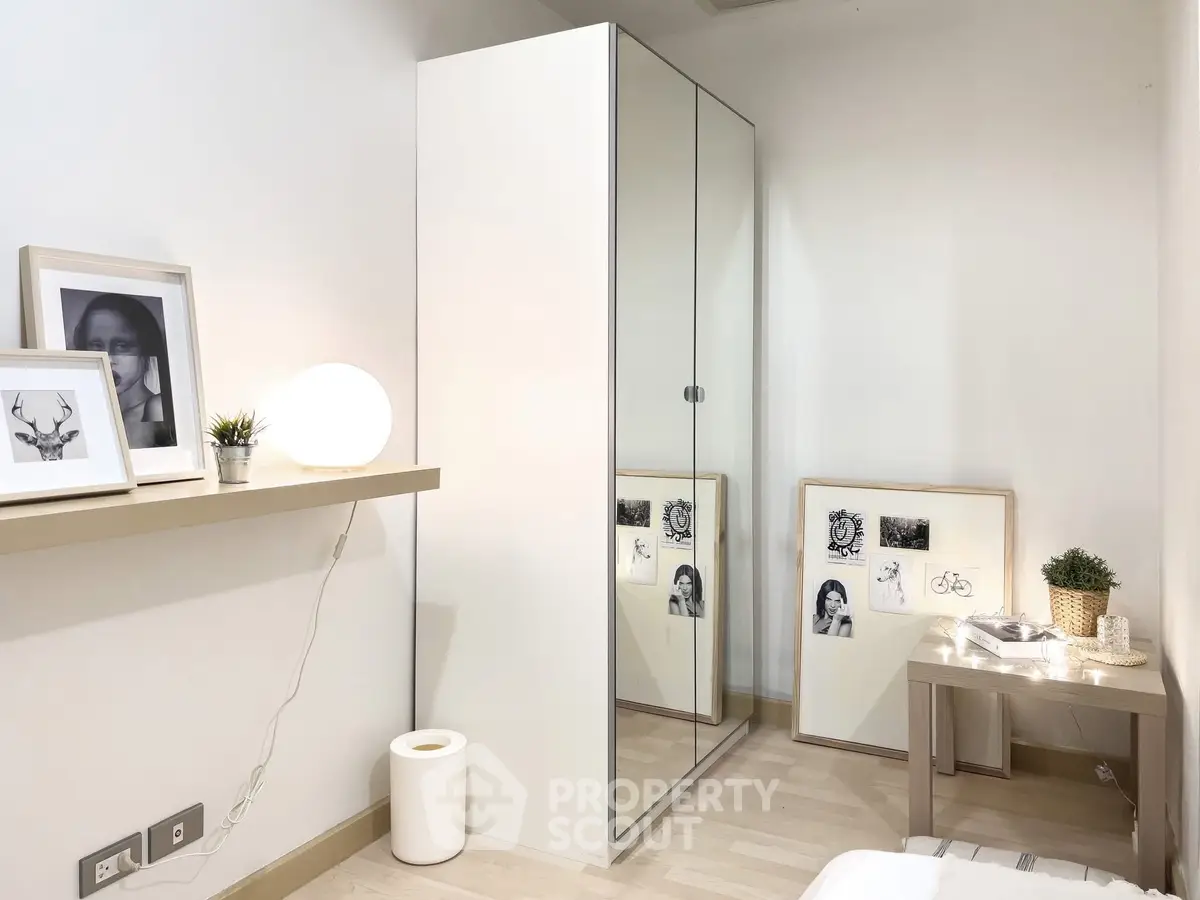 Modern minimalist bedroom with mirrored wardrobe and stylish decor