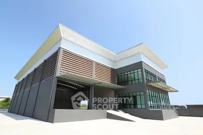 Modern industrial building with sleek design and large windows