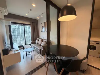 Modern living room with stylish furniture and city view, featuring a cozy dining area and in-unit laundry.