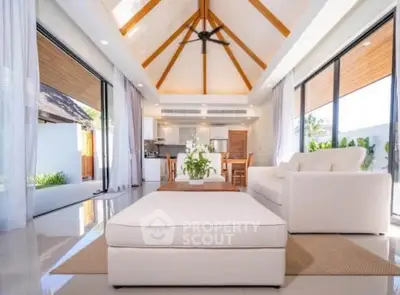 Luxurious open-plan living room with high ceilings and modern decor