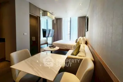 Modern studio apartment with cozy living area and stylish decor