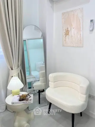 Stylish modern living room corner with elegant chair and mirror