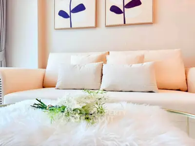 Elegant living room with plush white sofa and modern decor