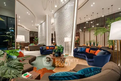 Luxurious modern living room with elegant furniture and ambient lighting, perfect for relaxation and entertainment.