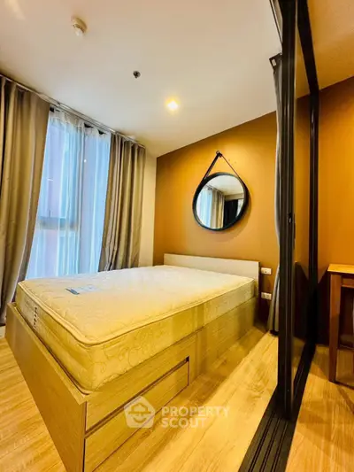 Modern bedroom with stylish decor and natural light in a contemporary apartment.