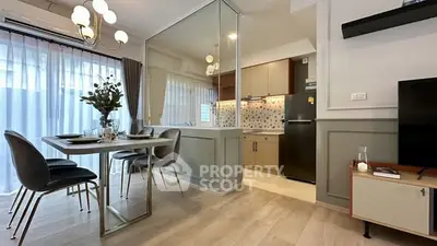 Modern dining area with elegant decor and open kitchen layout