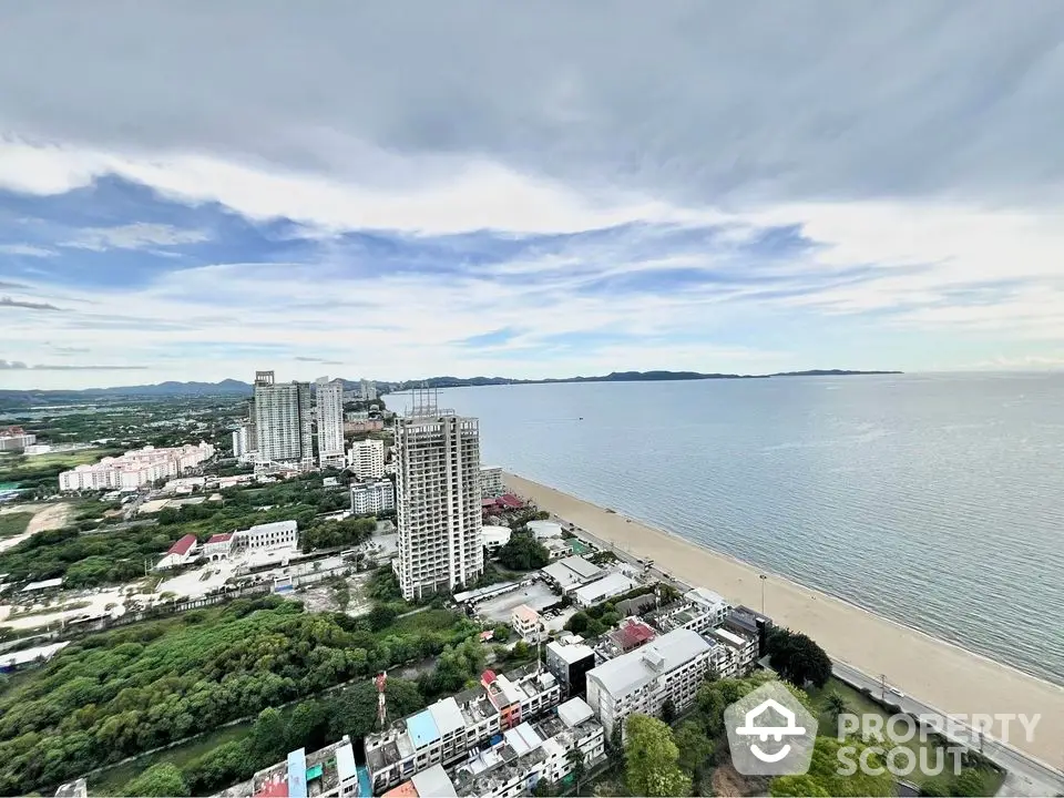 Stunning beachfront view from high-rise building in vibrant coastal cityscape.