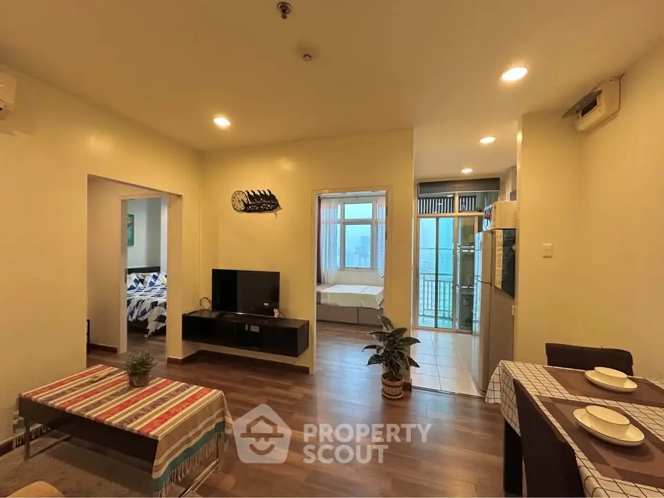 Spacious living room with modern decor and open view, perfect for comfortable urban living.