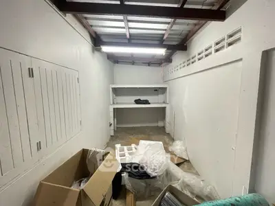 Spacious storage room with shelves and boxes, ideal for organizing belongings.