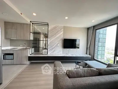 Modern living room with sleek design, large windows, and stylish furnishings in a high-rise apartment.