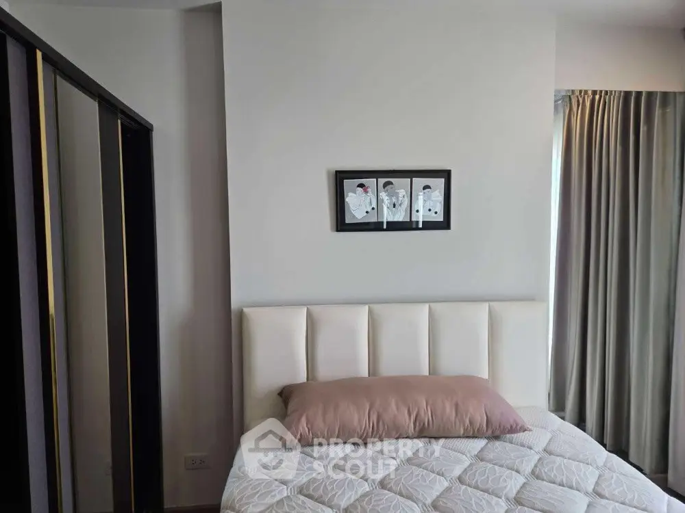 Cozy bedroom with modern decor and plush bedding in a stylish apartment