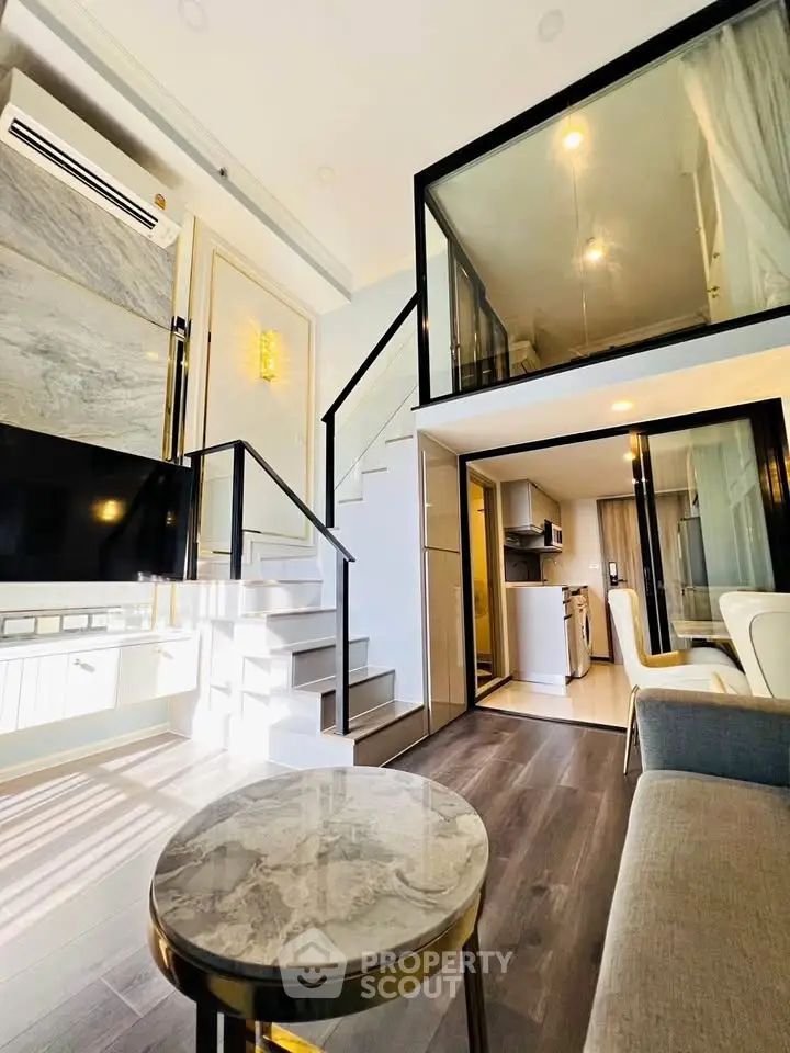 Modern duplex apartment with stylish interior and open layout, featuring a cozy living area and sleek kitchen.