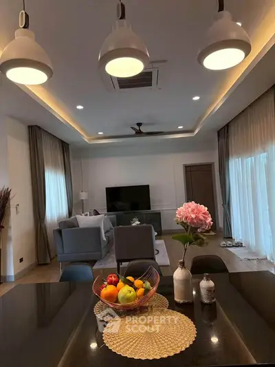 Luxurious modern living room with elegant decor and open layout, perfect for relaxation and entertainment.