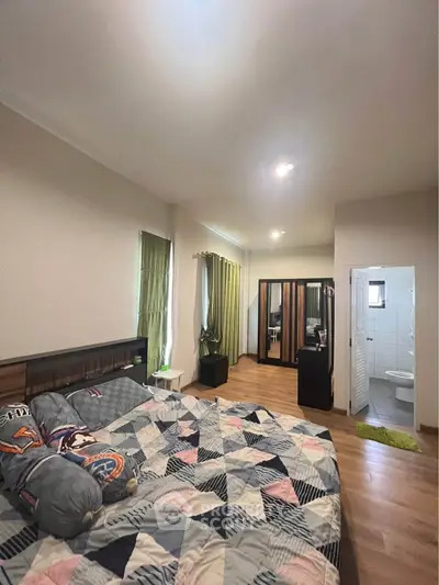 Spacious bedroom with ensuite bathroom and modern decor