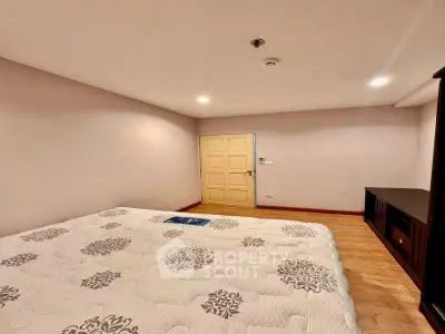 Spacious bedroom with elegant decor and cozy ambiance