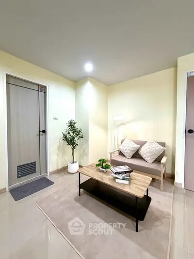 Cozy living room with modern decor and neutral tones, perfect for relaxation and entertaining.