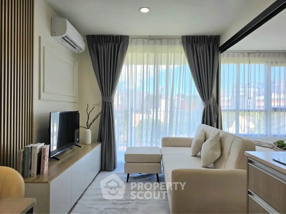 Modern living room with large windows and stylish decor