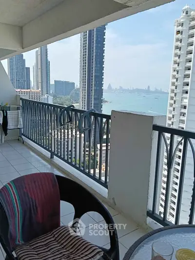 Stunning high-rise balcony with breathtaking ocean and city skyline views.