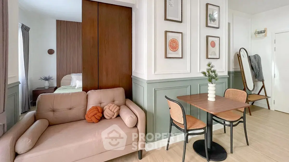 Chic modern living room with cozy seating and stylish dining area in open layout apartment.