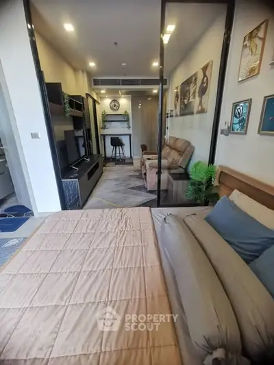 Modern studio apartment with cozy bedroom and stylish living area