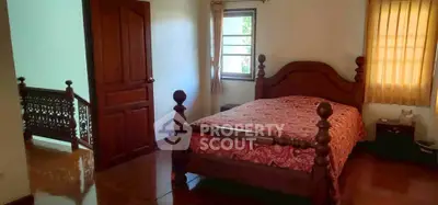 Charming bedroom with wooden furniture and warm lighting