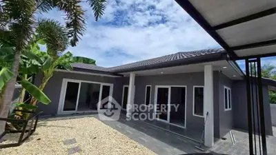 Modern single-story home with sleek design and spacious outdoor area.