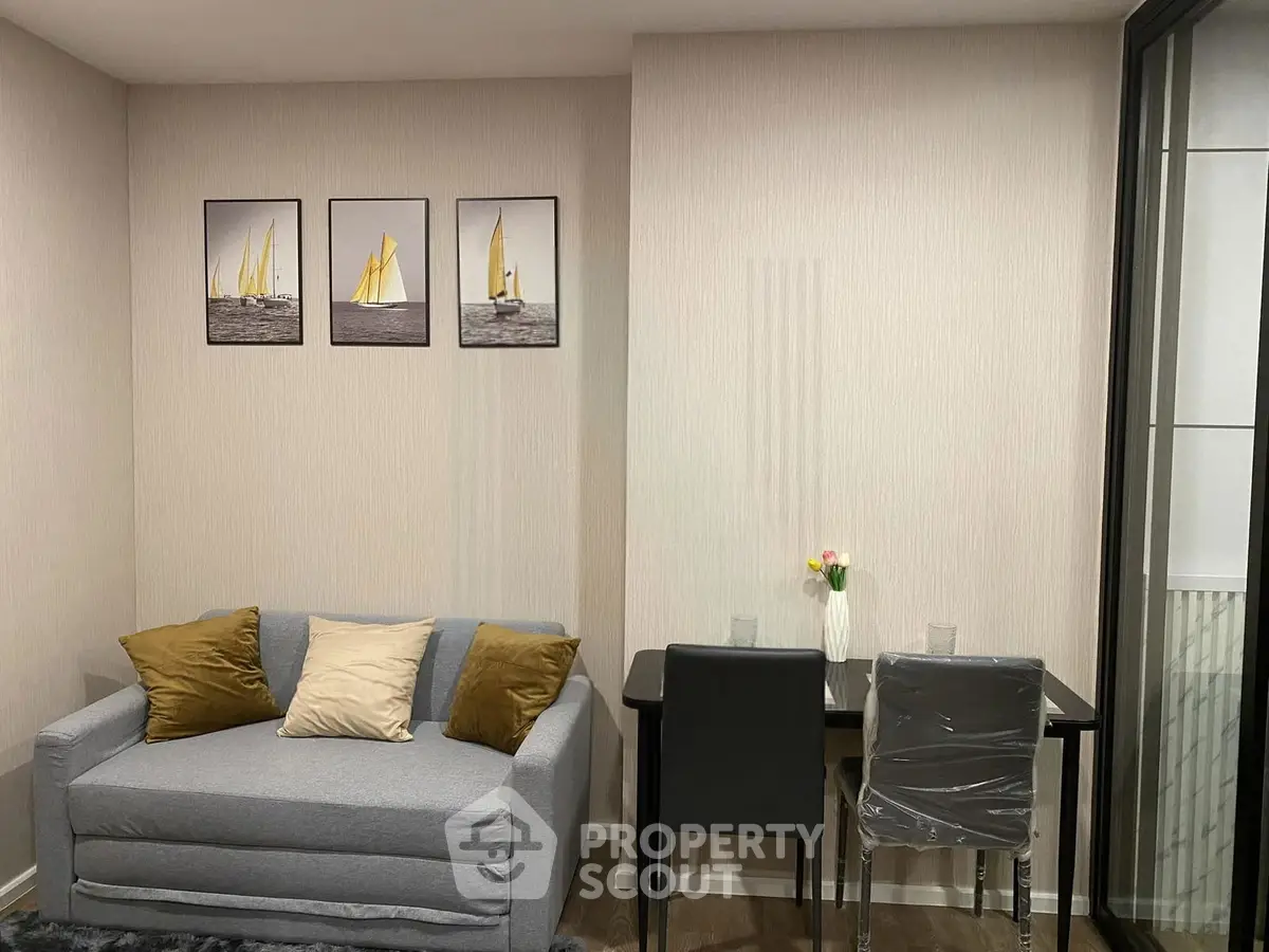 Modern living room with cozy sofa and dining area, perfect for urban living.