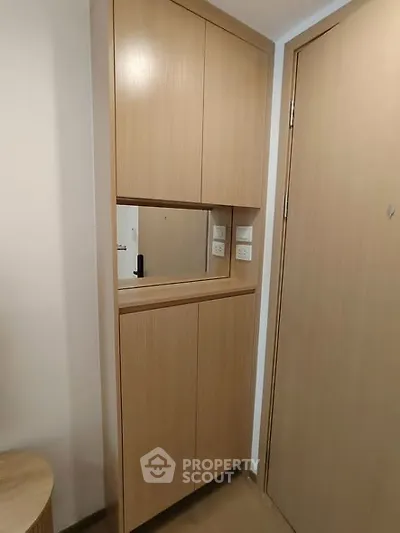Modern wooden storage cabinet in a sleek apartment interior