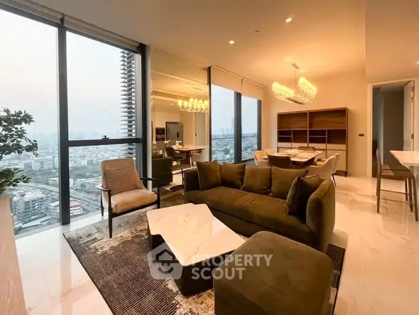 Luxurious high-rise living room with stunning city view and modern furnishings.
