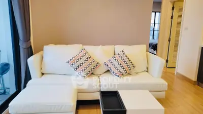 Modern living room with cozy white sofa and stylish decor