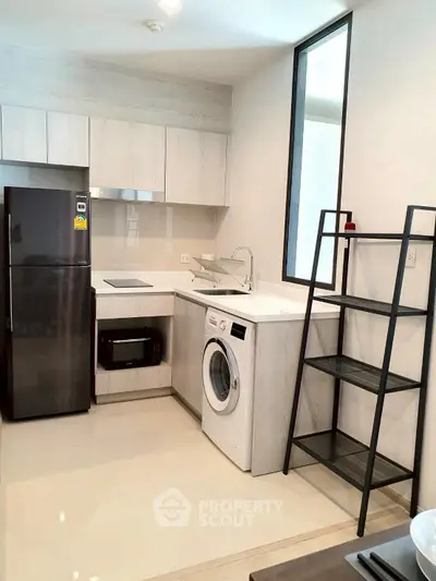 Modern kitchen with sleek appliances and open shelving
