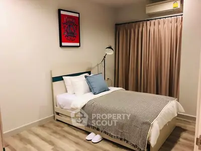 Cozy bedroom with single bed, stylish decor, and soft lighting for a relaxing ambiance.