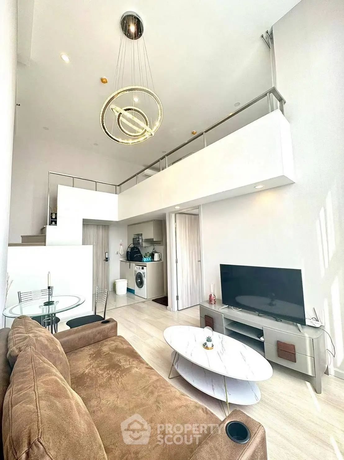 Modern loft-style living room with high ceilings and elegant furnishings